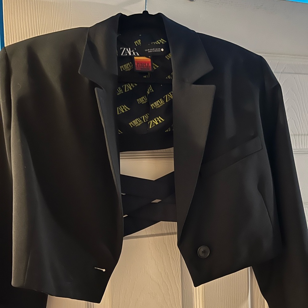 Cropped blazer with open back and ribbon detailing